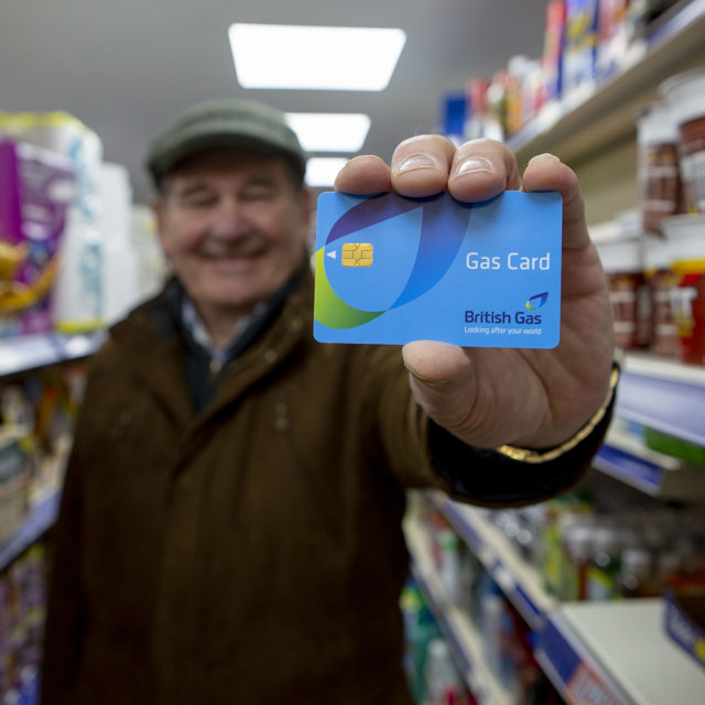 A customer holding a British Gas Card