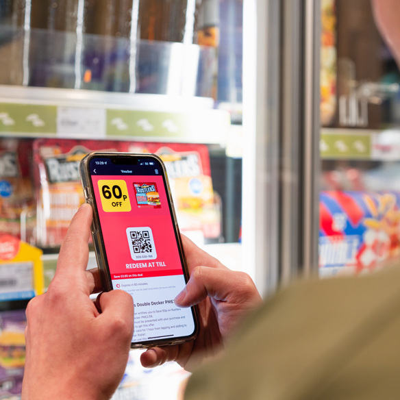 A retail customer using Jisp app on a smart phone