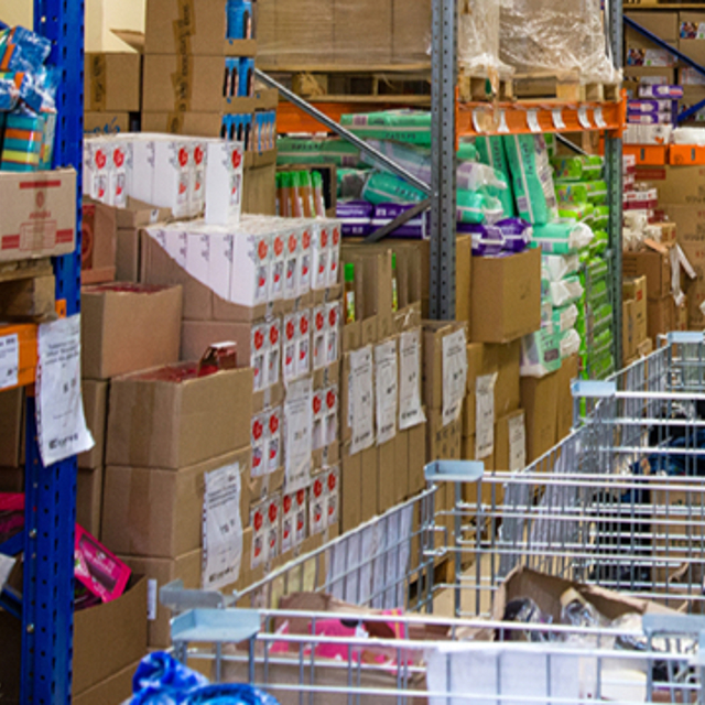 A retail stockroom with stock organised in aisles